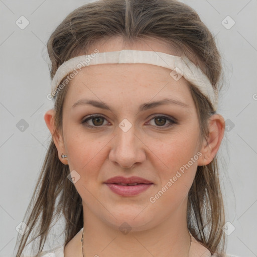 Joyful white young-adult female with medium  brown hair and grey eyes