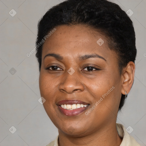 Joyful black young-adult female with short  black hair and brown eyes