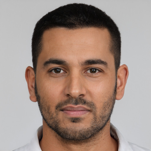 Neutral latino young-adult male with short  black hair and brown eyes