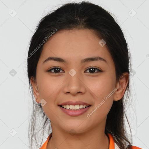 Joyful latino young-adult female with medium  brown hair and brown eyes