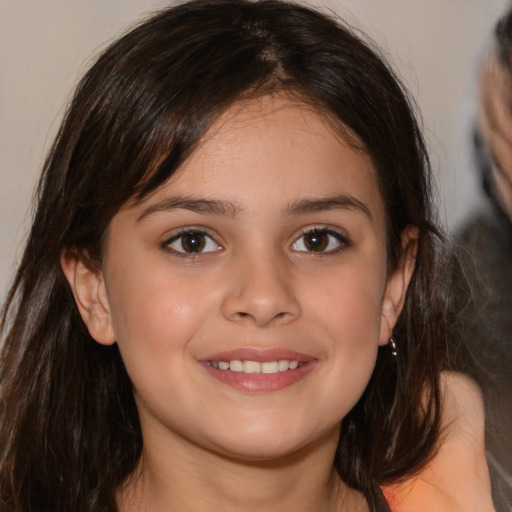 Joyful white child female with medium  brown hair and brown eyes