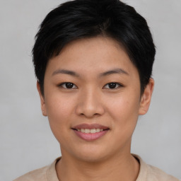 Joyful asian young-adult female with short  black hair and brown eyes