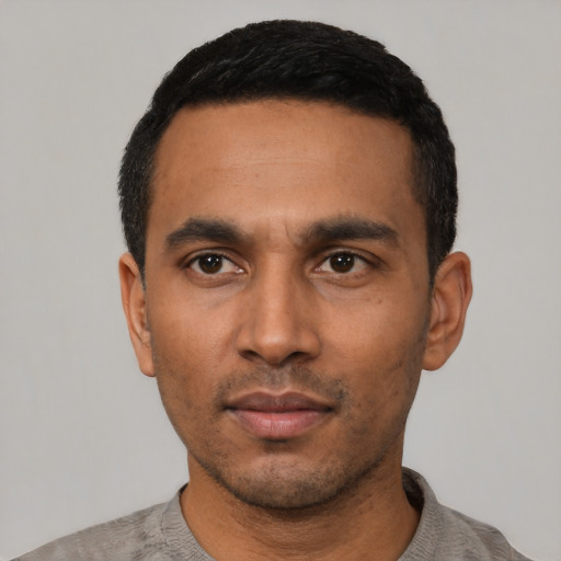 Neutral latino young-adult male with short  black hair and brown eyes