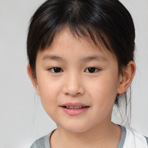 Joyful white child female with medium  brown hair and brown eyes