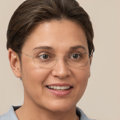 Joyful white adult female with short  brown hair and brown eyes