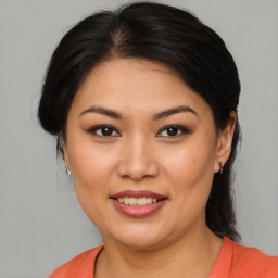 Joyful white young-adult female with medium  brown hair and brown eyes