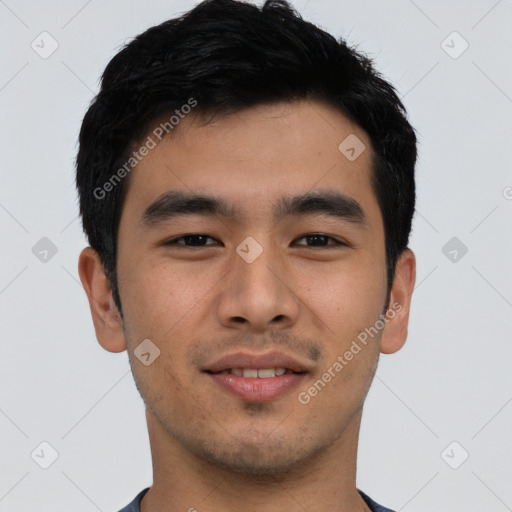 Joyful asian young-adult male with short  black hair and brown eyes