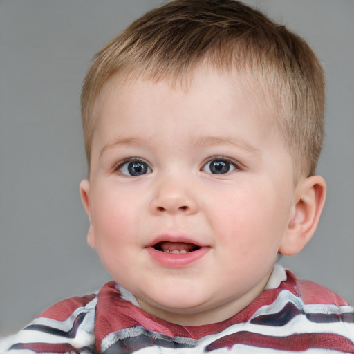 Joyful white child male with short  brown hair and blue eyes