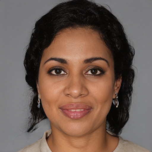 Joyful black young-adult female with medium  black hair and brown eyes