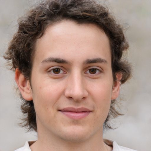 Joyful white young-adult male with medium  brown hair and brown eyes