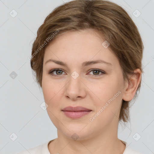 Joyful white young-adult female with medium  brown hair and green eyes