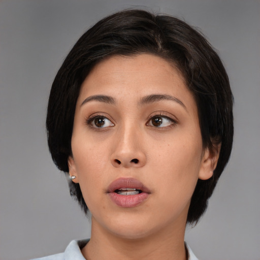 Neutral asian young-adult female with medium  brown hair and brown eyes