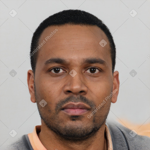 Neutral latino young-adult male with short  black hair and brown eyes