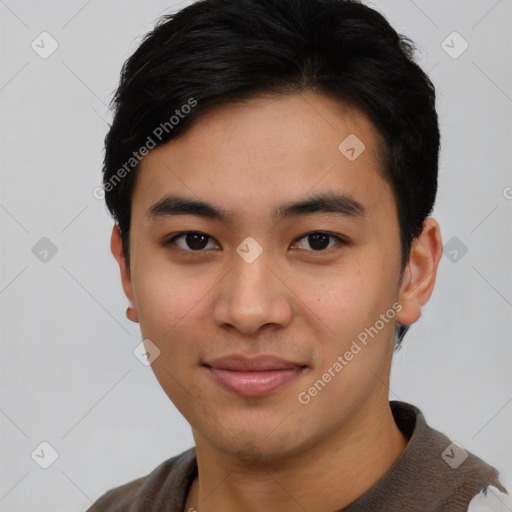 Joyful asian young-adult male with short  black hair and brown eyes