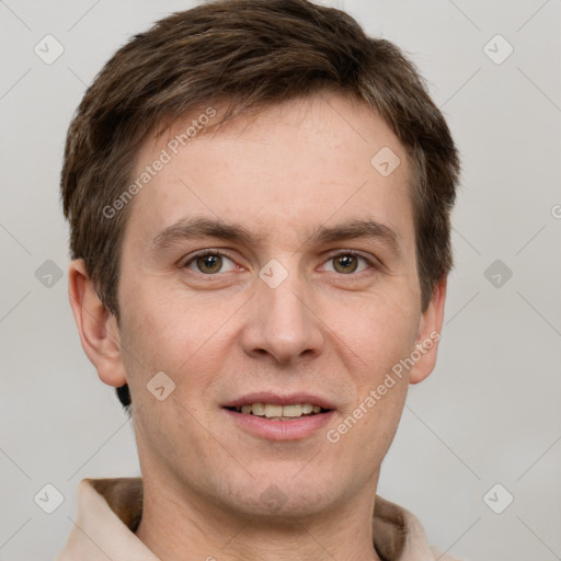 Joyful white adult male with short  brown hair and grey eyes