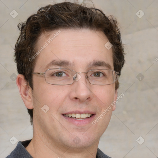 Joyful white adult male with short  brown hair and grey eyes