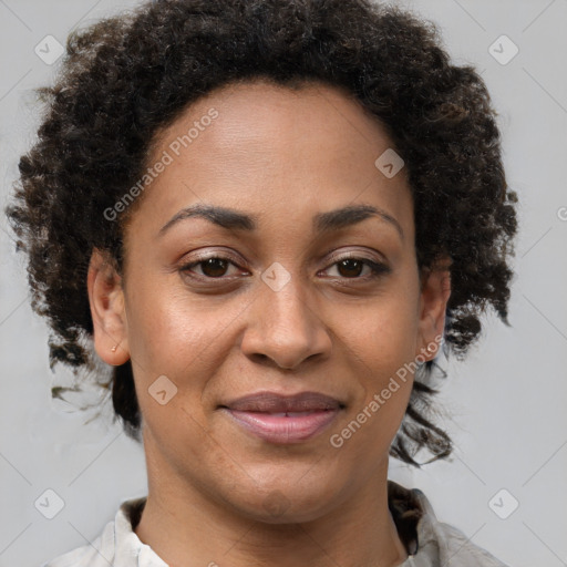 Joyful black adult female with short  brown hair and brown eyes