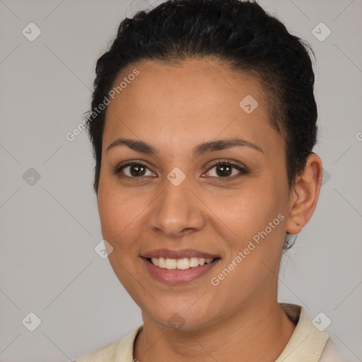 Joyful latino young-adult female with short  brown hair and brown eyes