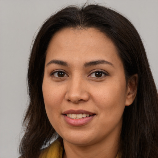 Joyful asian young-adult female with long  brown hair and brown eyes