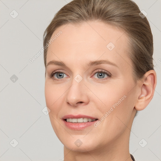 Joyful white adult female with short  brown hair and grey eyes