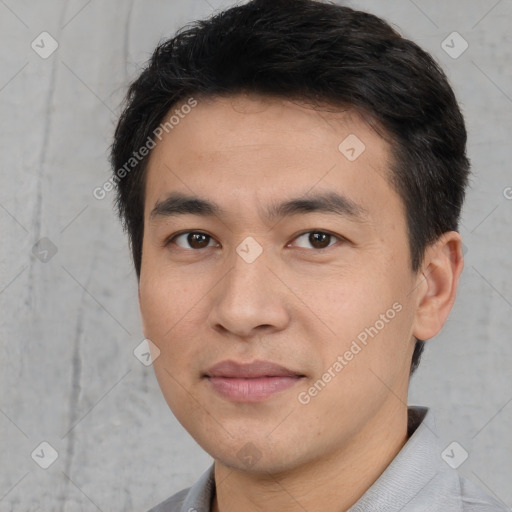 Joyful white young-adult male with short  black hair and brown eyes