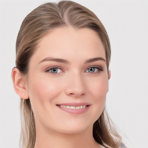 Joyful white young-adult female with long  brown hair and grey eyes