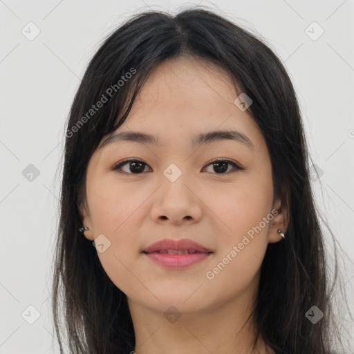 Joyful asian young-adult female with long  brown hair and brown eyes