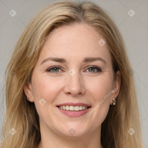 Joyful white adult female with long  brown hair and grey eyes