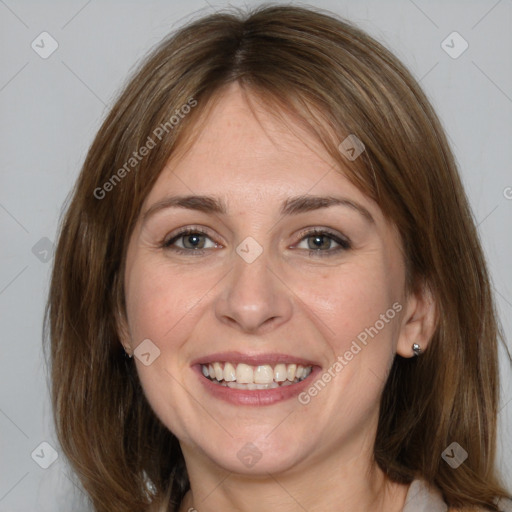 Joyful white adult female with medium  brown hair and grey eyes