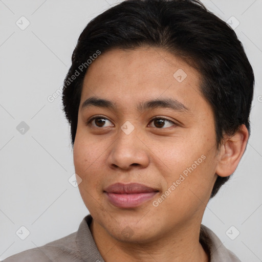 Joyful asian young-adult male with short  brown hair and brown eyes