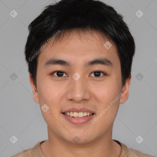 Joyful asian young-adult male with short  brown hair and brown eyes