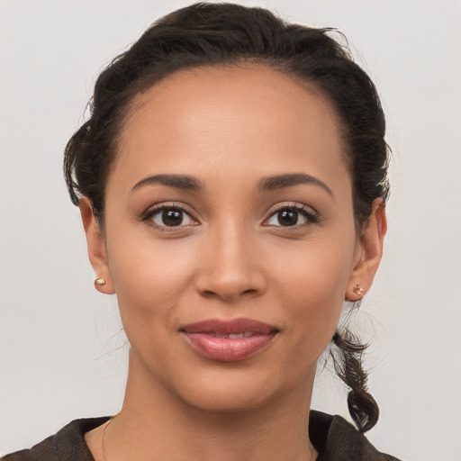 Joyful white young-adult female with medium  brown hair and brown eyes