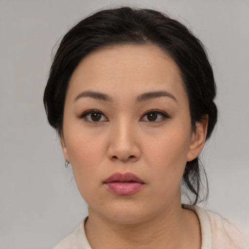 Neutral asian young-adult female with medium  black hair and brown eyes