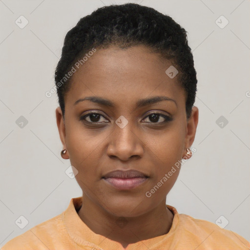 Joyful black young-adult female with short  black hair and brown eyes