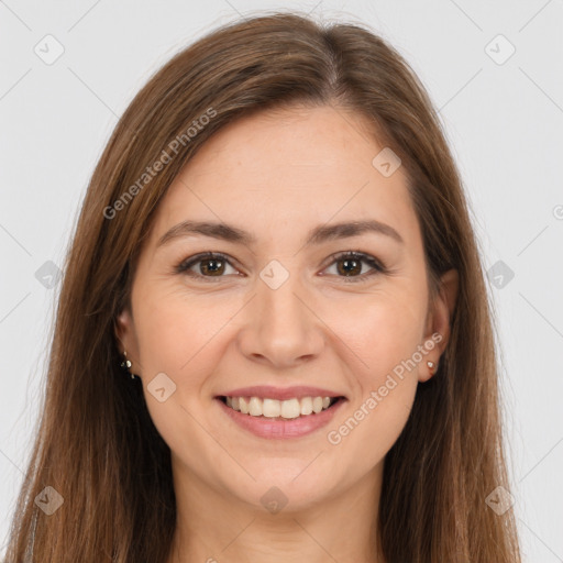 Joyful white young-adult female with long  brown hair and brown eyes