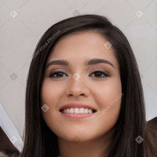 Joyful white young-adult female with long  black hair and brown eyes