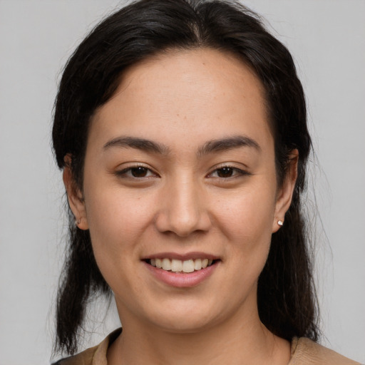 Joyful asian young-adult female with medium  brown hair and brown eyes