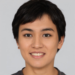 Joyful asian young-adult female with short  black hair and brown eyes