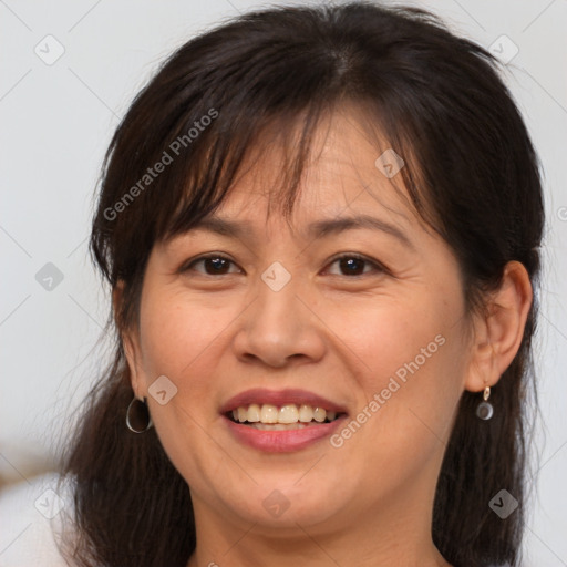 Joyful white adult female with medium  brown hair and brown eyes