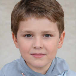 Joyful white child male with short  brown hair and brown eyes