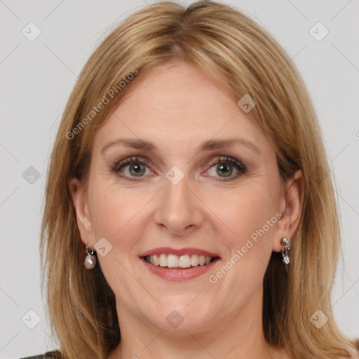 Joyful white adult female with medium  brown hair and brown eyes