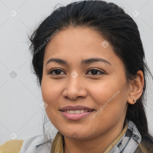 Joyful latino young-adult female with medium  brown hair and brown eyes