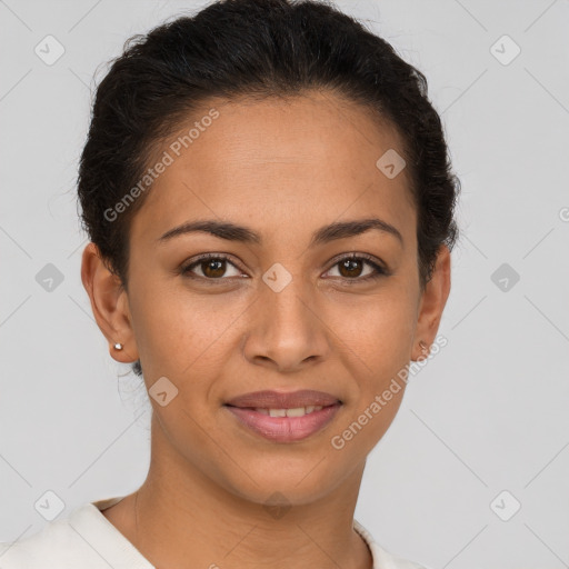 Joyful latino young-adult female with short  brown hair and brown eyes