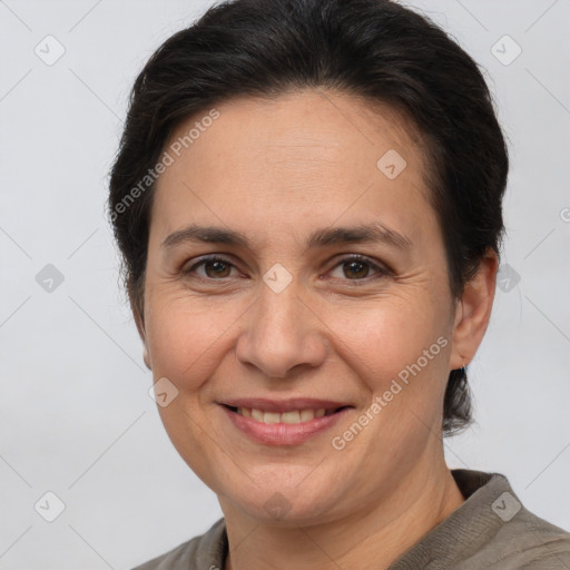 Joyful white adult female with short  brown hair and brown eyes