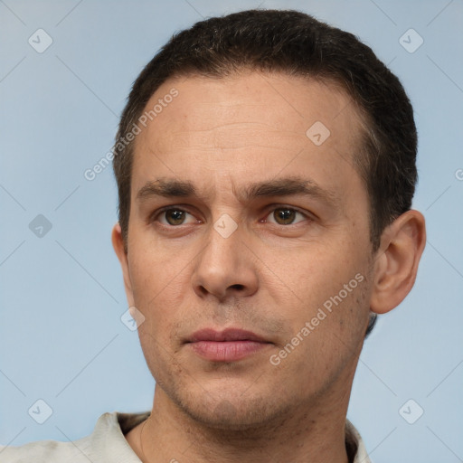 Joyful white adult male with short  brown hair and brown eyes