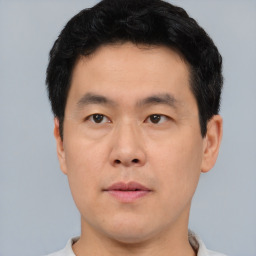 Neutral asian young-adult male with short  black hair and brown eyes