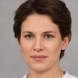 Joyful white adult female with short  brown hair and brown eyes