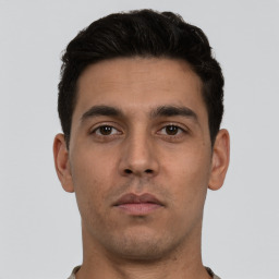Neutral white young-adult male with short  black hair and brown eyes
