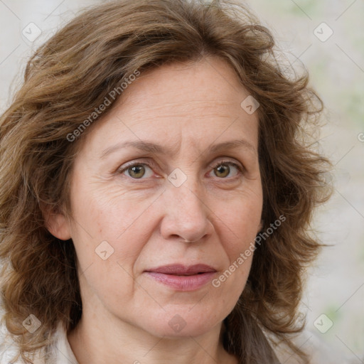 Joyful white adult female with medium  brown hair and green eyes