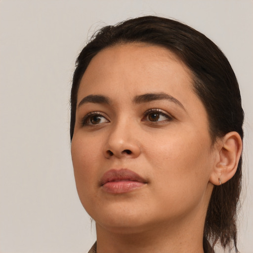 Neutral white young-adult female with medium  black hair and brown eyes